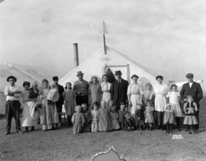 Portrait of men, women, and children at the UMW camp for coal miners on strike against CF&I in Ludlow, Las Animas County, Colorado, 1914 (Denver Public Library Special Collections)