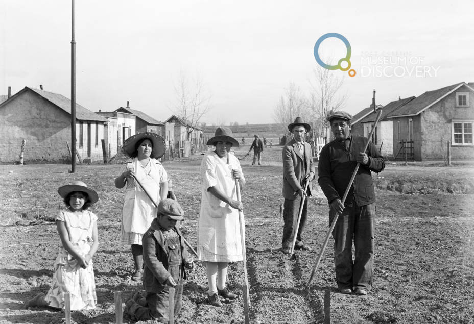 People gardening, likely in the Tres Colonias neighborhoods in Fort Collins, Colorado